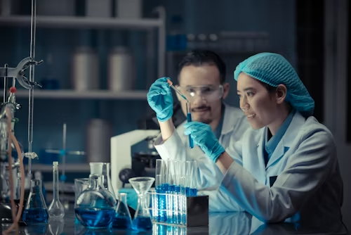 Scientists conducting laboratory research with test tubes